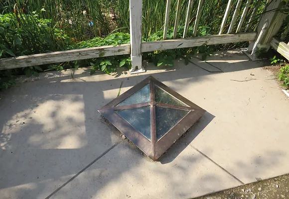 The window and platform above the first cornerstone erected to mark the border of the District of Columbia.
