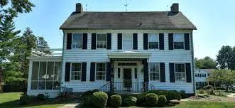 The historic Belvale house is pictured before a mansion was built blocking its view.