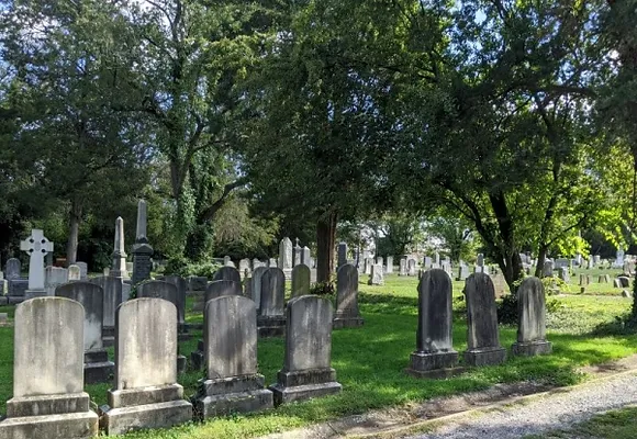 Weathered gravestones stand in the Wilkes Street cemetery complex.