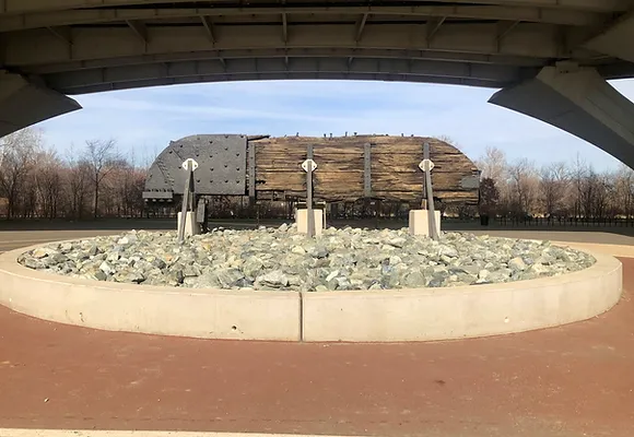 The wooden rudder of an old sailing ship that stands on display in the courtyard of Jones Point Park underneath the Woodrow Wilson Bridge in Alexandria.