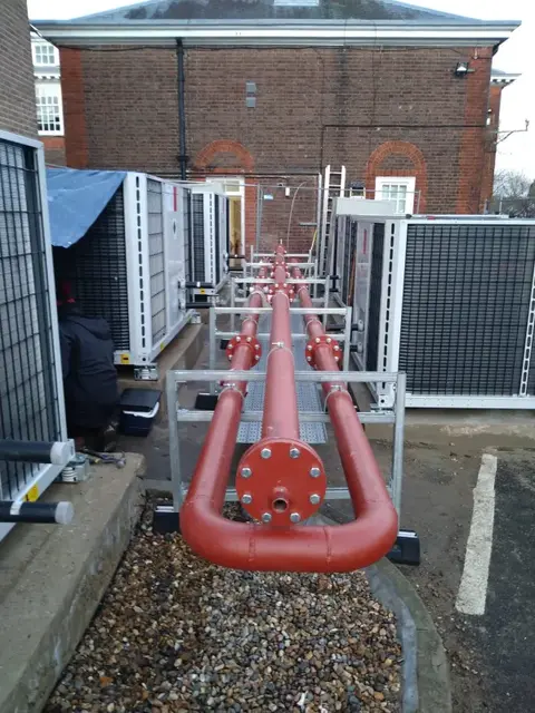 red metal pipework