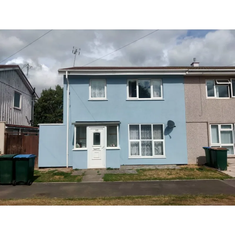 outside of a blue house