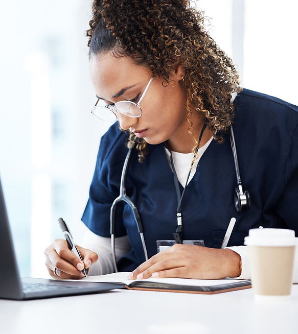 a lady doctor writing in notebook