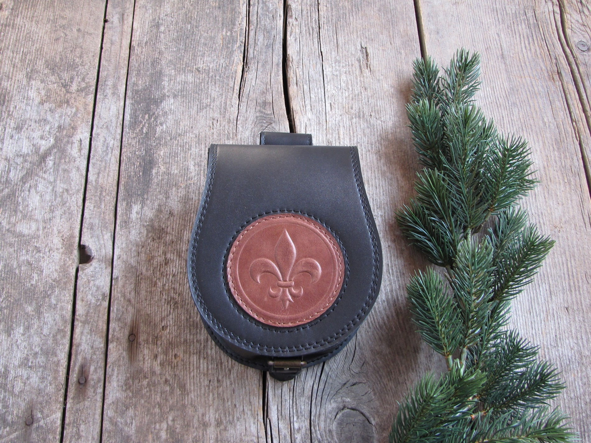 Embossed pouch with lily