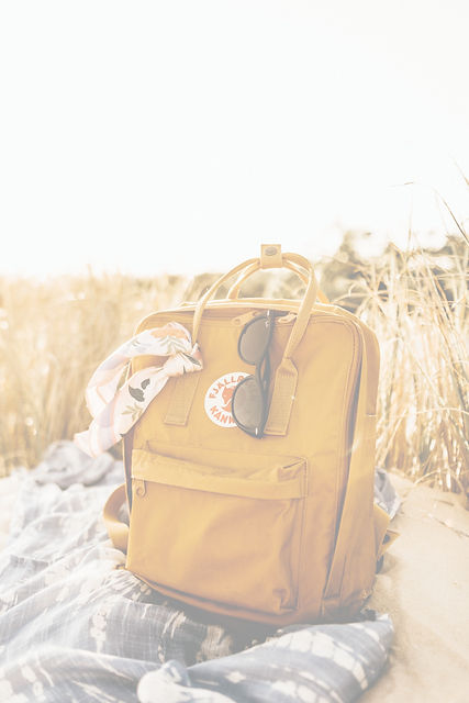 brown leather backpack on snow covered ground during daytime_edited.jpg