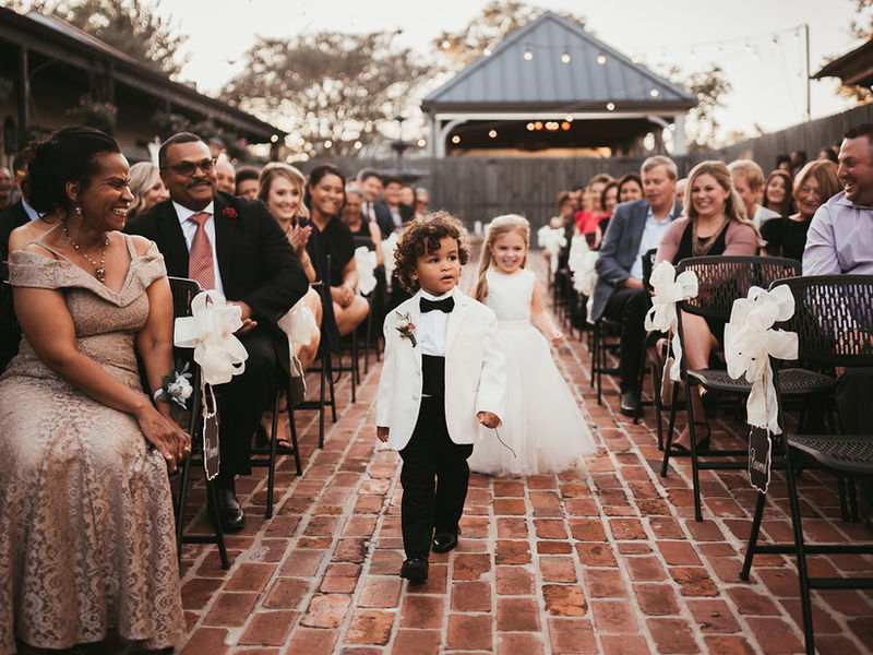 Outdoor wedding reception at Maison De Tours historic courtyard venue Saint Martinville Louisiana