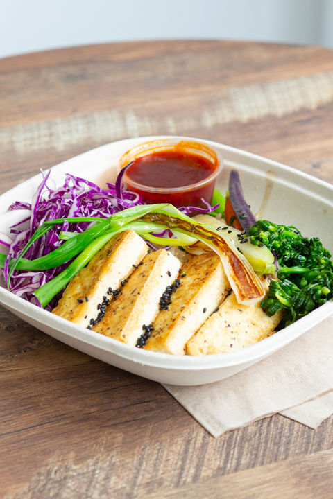 grilled tofu bowl in a biodegradable bowl