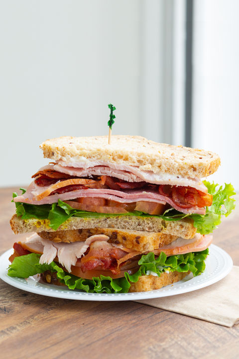 club sandwich cut in half on a plate