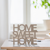 A sign that says home sweet home.
