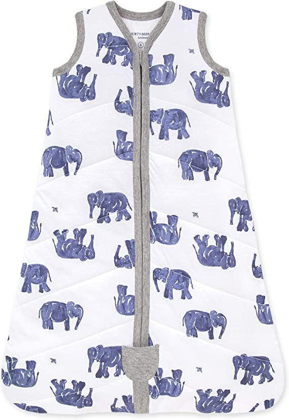 A burts-bees baby sleep sack with blue elephants on it.