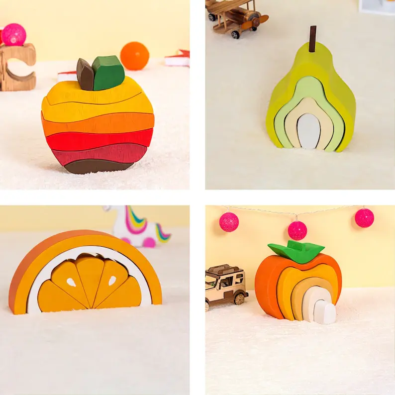 Wooden puzzles in the shape of an orange, pear, apple, and different apple.