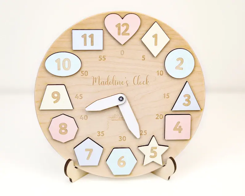 A pastel wooden clock puzzle with shapes and numbers.