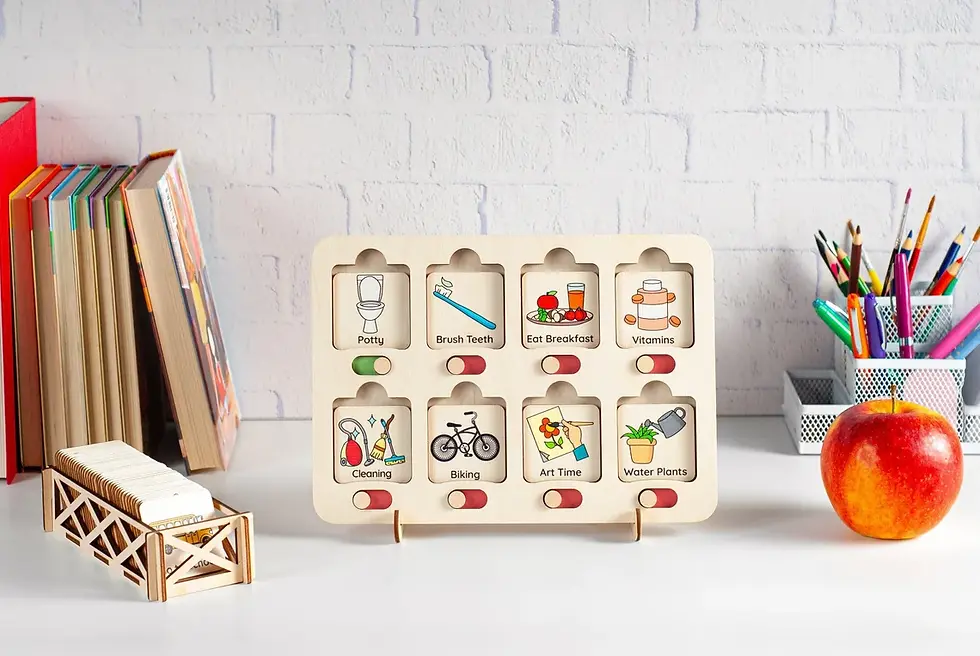 A toddler chore chart sitting on a desk next to an apple.