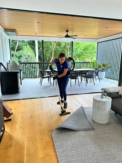 Vacuuming under mat - House Cleaning Brisbane.webp