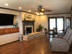 We strive to provide the comforts of home for our residents, and our family room is a prime example. The couches, recliners, fireplace, large TV, and hardwood floors are all very homey and cozy, so they really feel like they're relaxing at home.