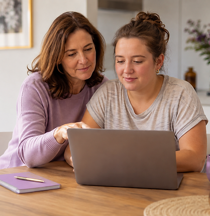 Two women reviewing NDIS plan management information on a laptop