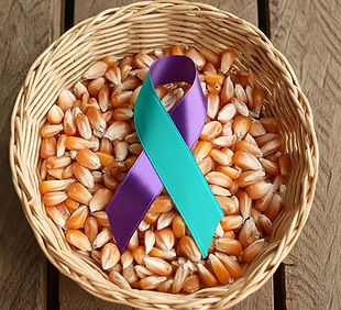Firefly Purple and teal awareness ribbon in a basket of corn 39885.jpg