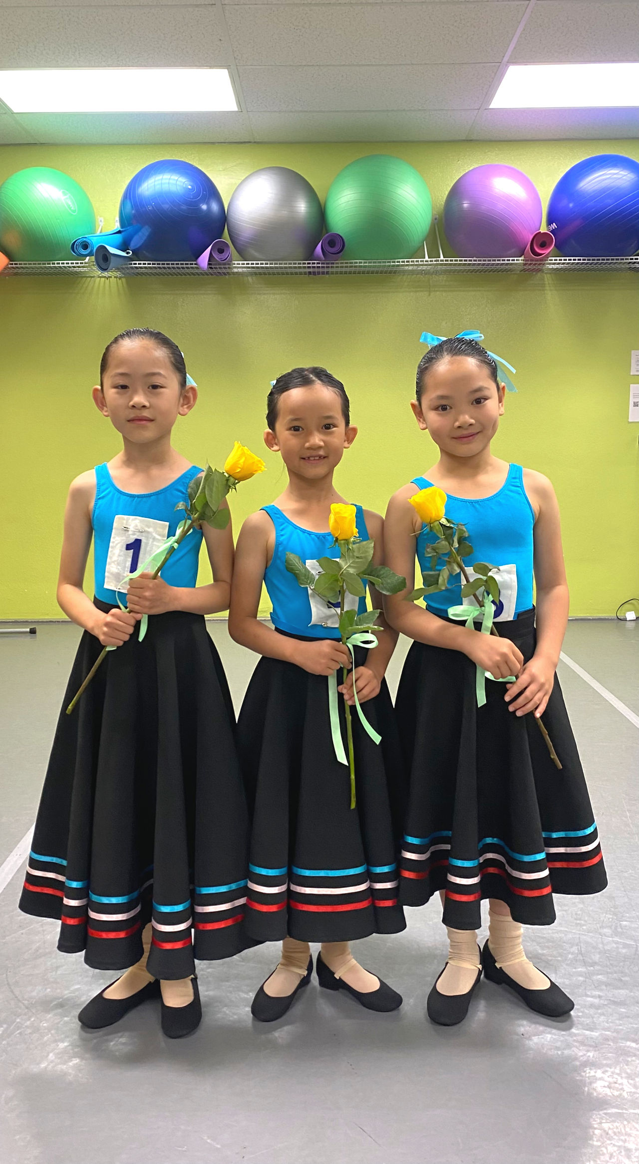 Young ballet dancers marking a milestone after completing their RAD exam.