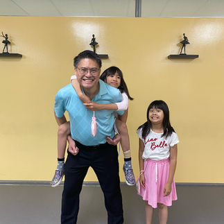 Father and daughters dancing at a San Gabriel Valley community event hosted by Ballet Kukan Academy
