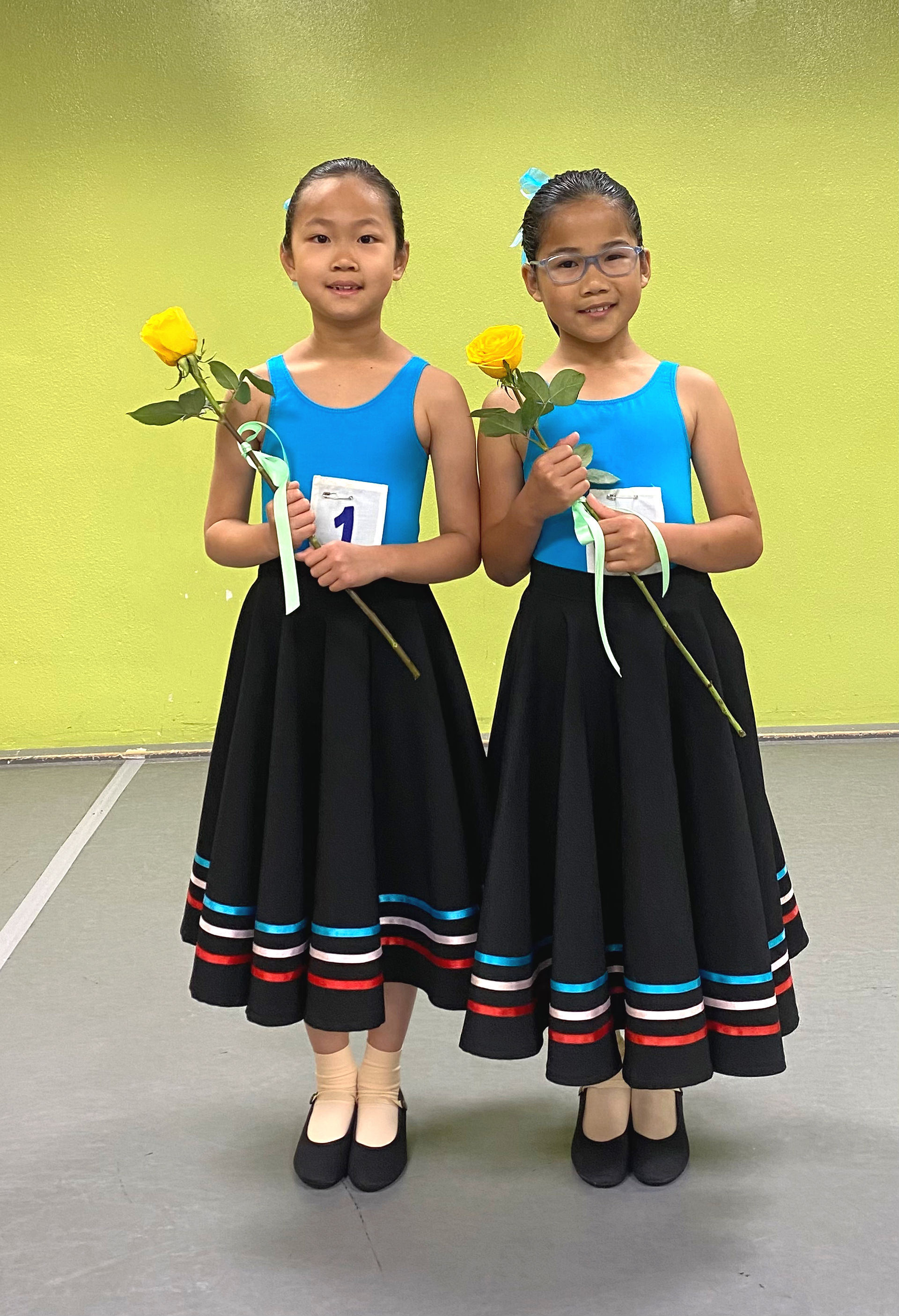 Young students celebrating their dedication and progress through the RAD ballet program.