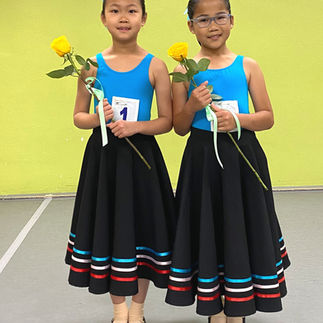 Young students celebrating their dedication and progress through the RAD ballet program.