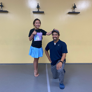A father and daughter enjoying quality time together at a Father-Daughter Dance Night in Monrovia.