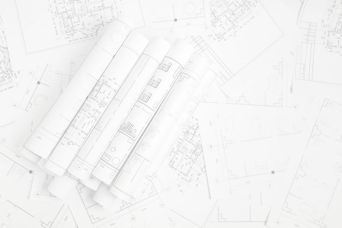 Paper architectural drawings and blueprint_edited.jpg