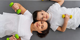 medium-shot-woman-kid-with-dumbbells_edited (2) (1).jpg