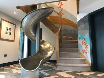 hallway mural next to spiral slide