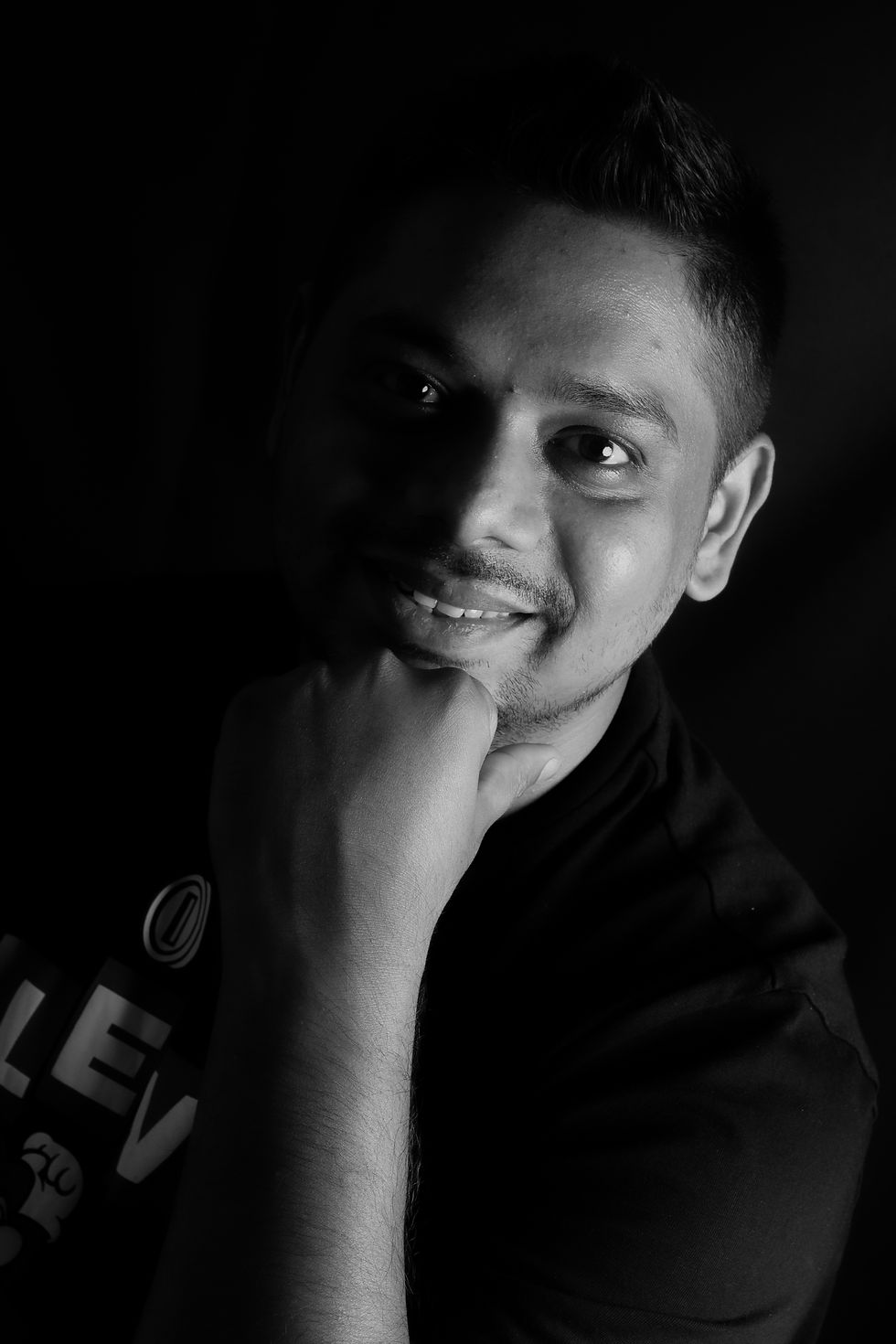 Side lighting to give shadow and a dramatic effect to the portrait. It also give more depth to your subject
