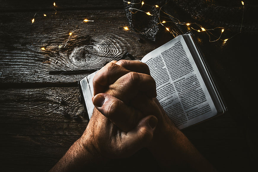 person holding book page with string lights_edited.jpg