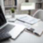 A clean, soft-focus background featuring a flat lay of a professional workspace. The scene