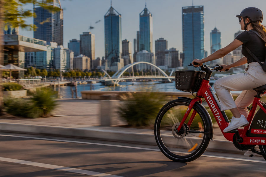Staff commuting through Perth on an e-bike