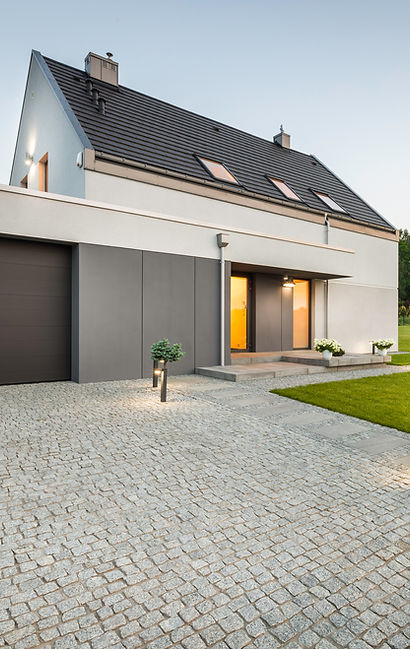 Stone driveway, garage and big garden at