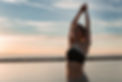 sports-lady-at-the-beach-make-meditate-exercises.jpg