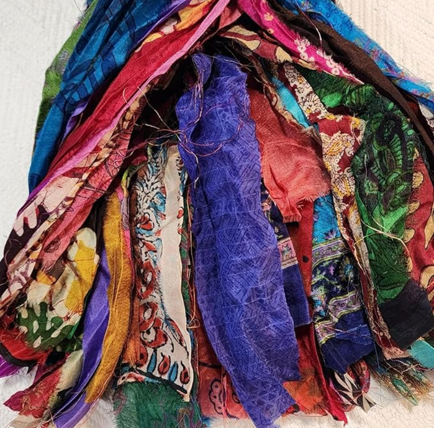 sari ribbon scraps of satin and silk fabrics braided to use as craft ribbon. bright colors from india