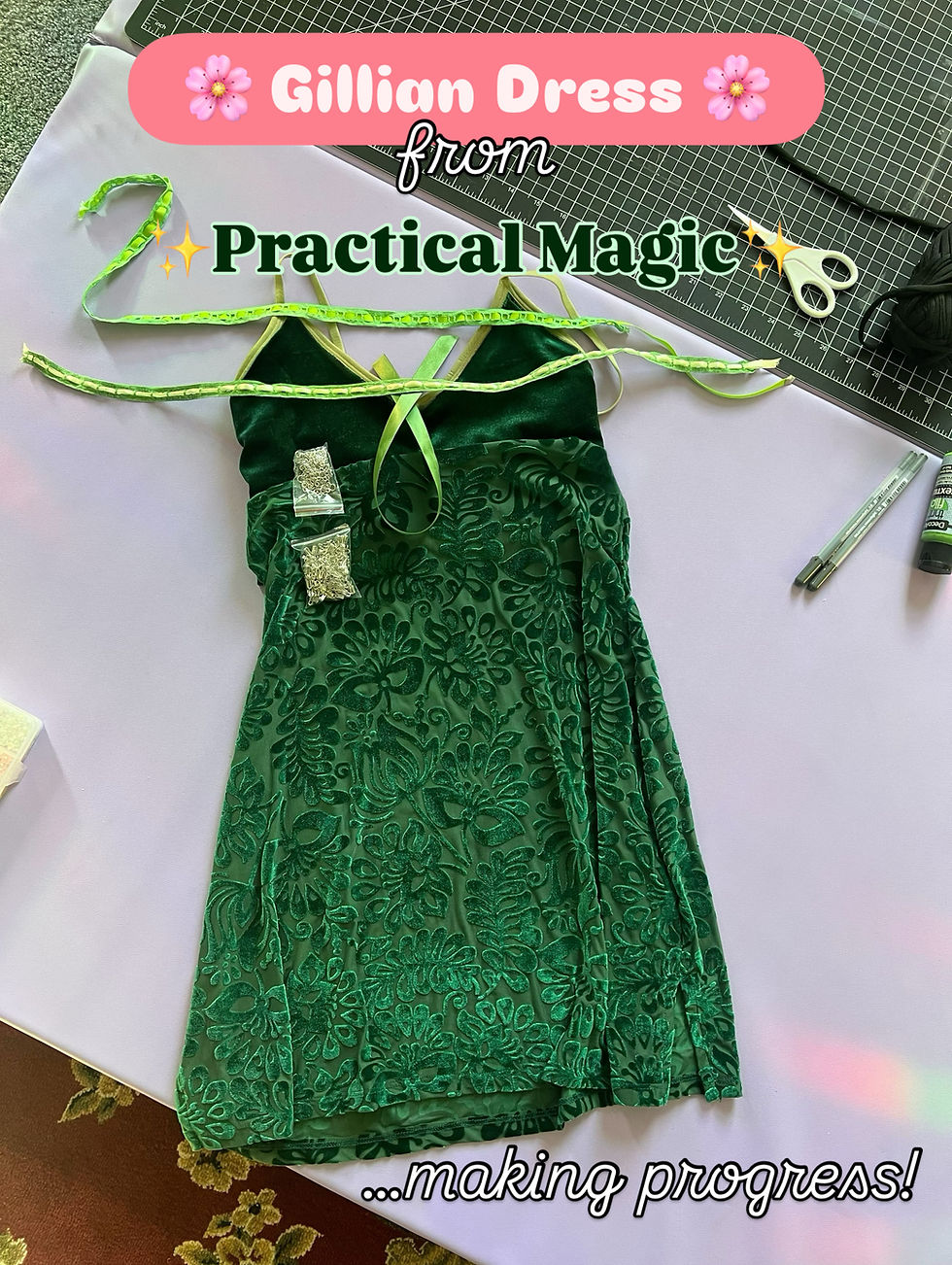 My version of the dress next to my cutting mat and on top of the tumbling mats i do my work on. it has the trims sitting on top of it not yet attached as it is a work in progress but it looks as exact to the gillian owens dress as i could possibly manage