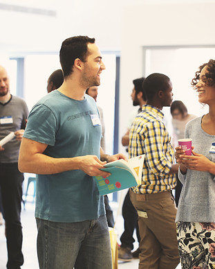 Networking event where individuals are speaking to each other