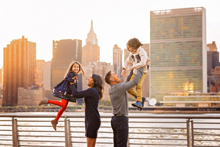 Family picture on phone - Parents lifting children.jpg
