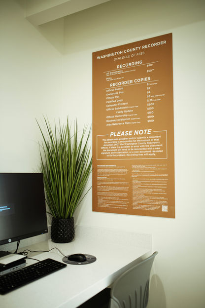 "Washington County Recorder" fees listing and informational plaque. 