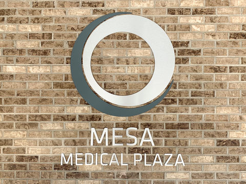 Closeup of the "Mesa Medical Plaza" exterior building sign and logo.