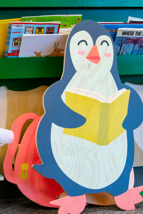 Printed wooden penguin graphic.