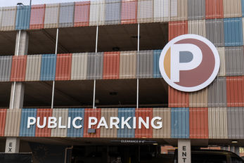 Large "P" logo sign and "Public Parking" exterior signage. 