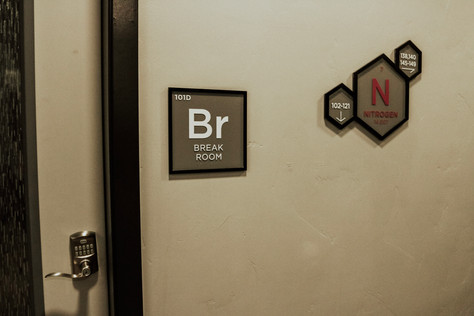 "Br - Break Room" sign, mimicking the design and layout of an element from the periodic table. Next to the Nitrogen Floor Id and attached room wayfinding.