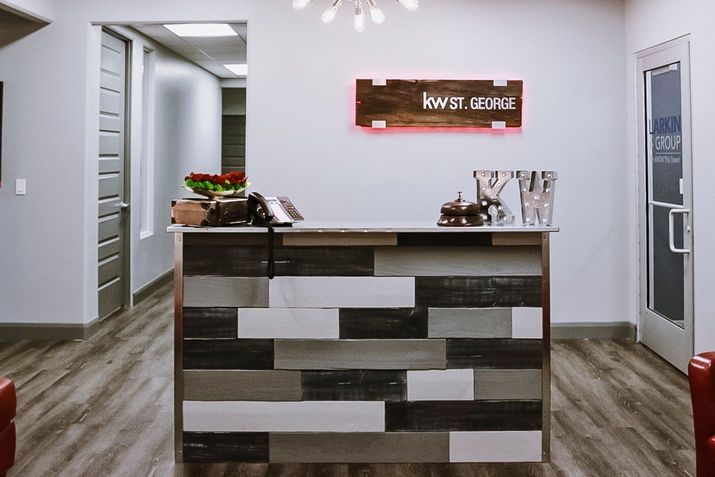 Tiled reception desk and "kwst St. George" sign