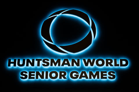 "Huntsman World Senior Games" Exterior signage including Huntsman logo and lettering lit by hidden LEDs, shown at night to demonstrate the LEDs in full