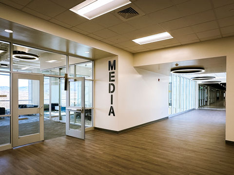 "Media" vertical vinyl lettering cut into the school's font.