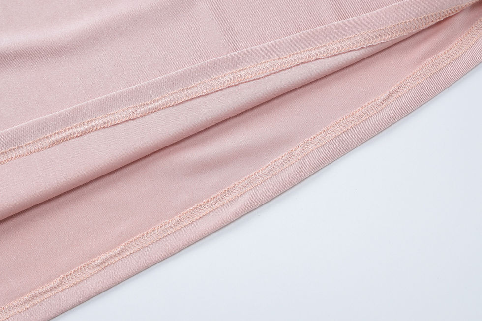 Thumbnail: Close-up of pink ruched wedding party dress fabric seam