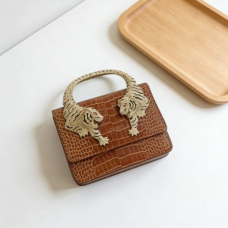 Thumbnail: Brown mini messenger purse with tiger-shaped metal handle