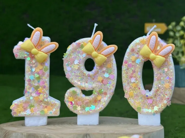 Thumbnail: Small glittery birthday candles forming the number 190